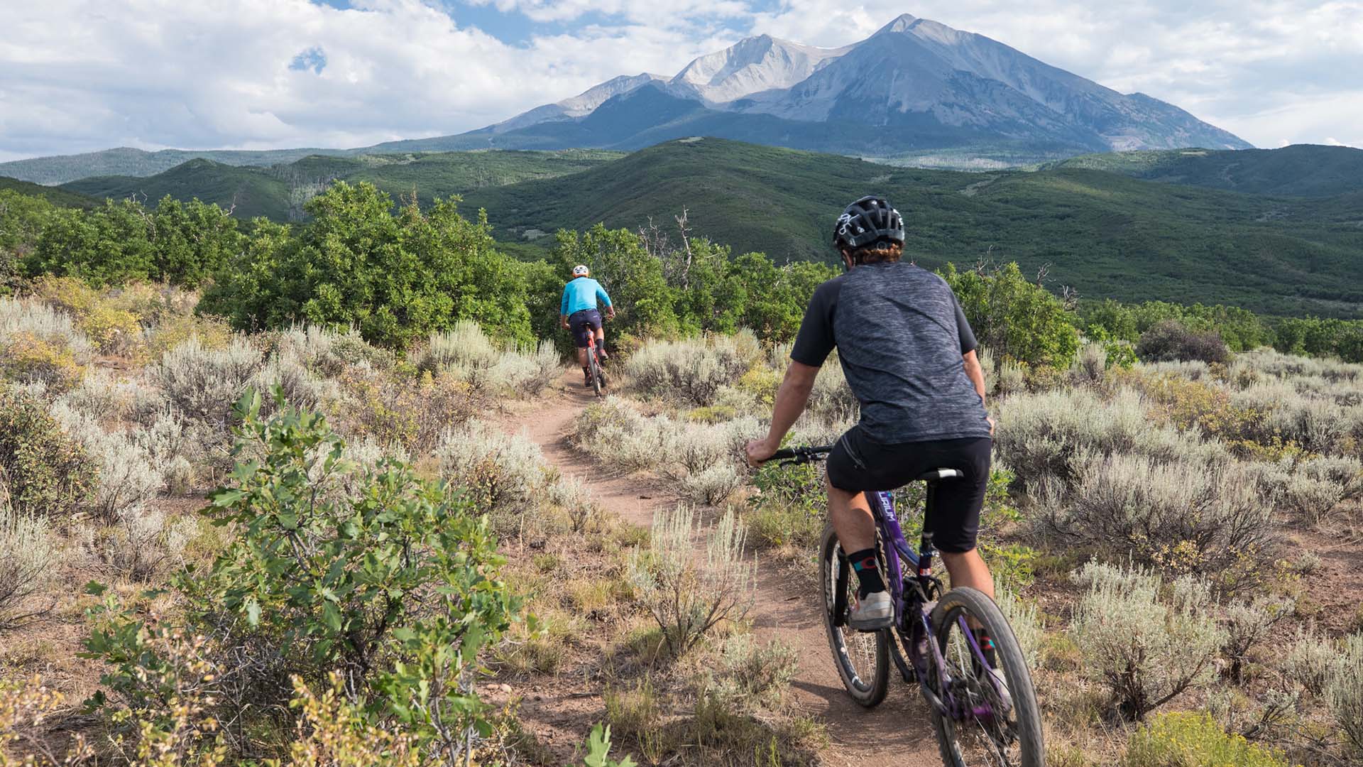 Man riding an e-bike on a trail in Colorado
